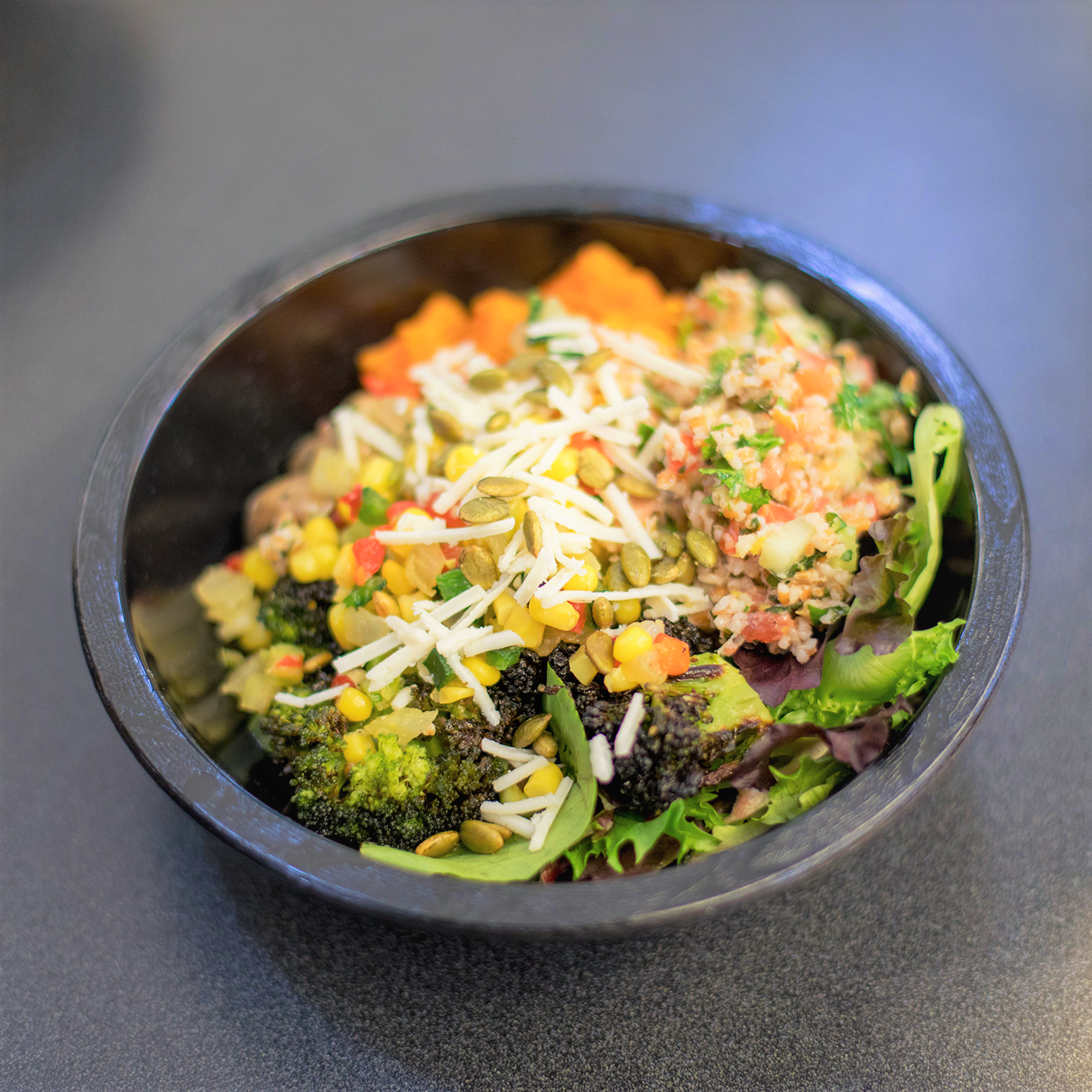 A grain bowl with rice and veggies. 